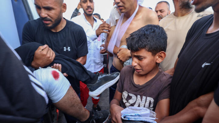 Palestinian rescuers evacuate injured people in an ambulance after an Israeli drone reportedly opened fire on civilian gatherings near an aid distribution point not far from the so-called "Netzarim checkpoint", central Gaza Strip, June 1, 2025.